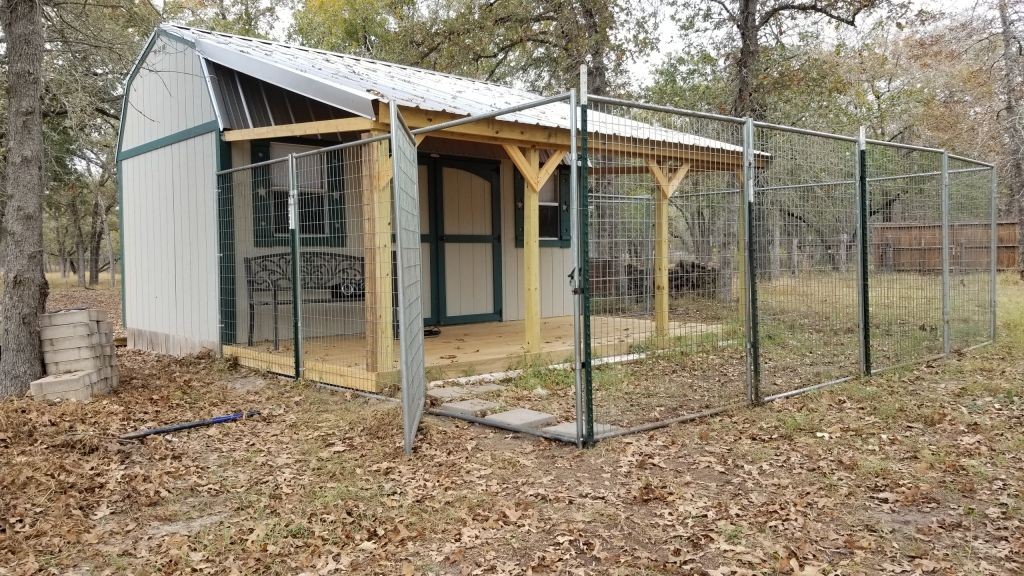 An the kennel is finished. Doggie door in and fencing in place